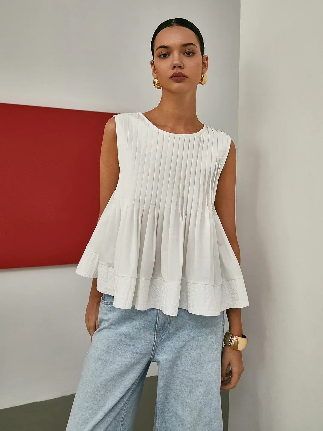 Blusa sin Mangas con Peplum Plisado